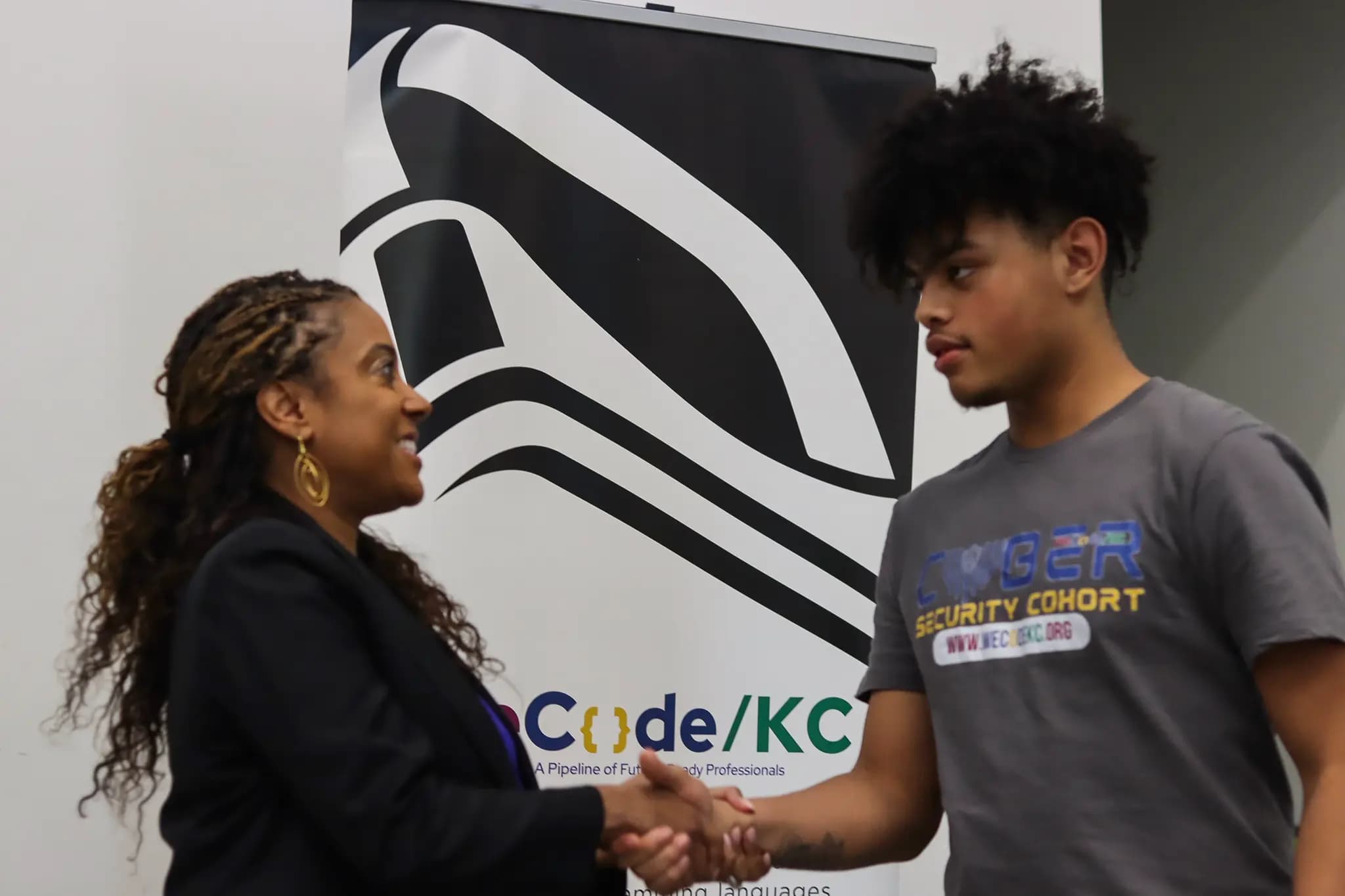 WeCode KC student graduating with Cybersecurity certificate