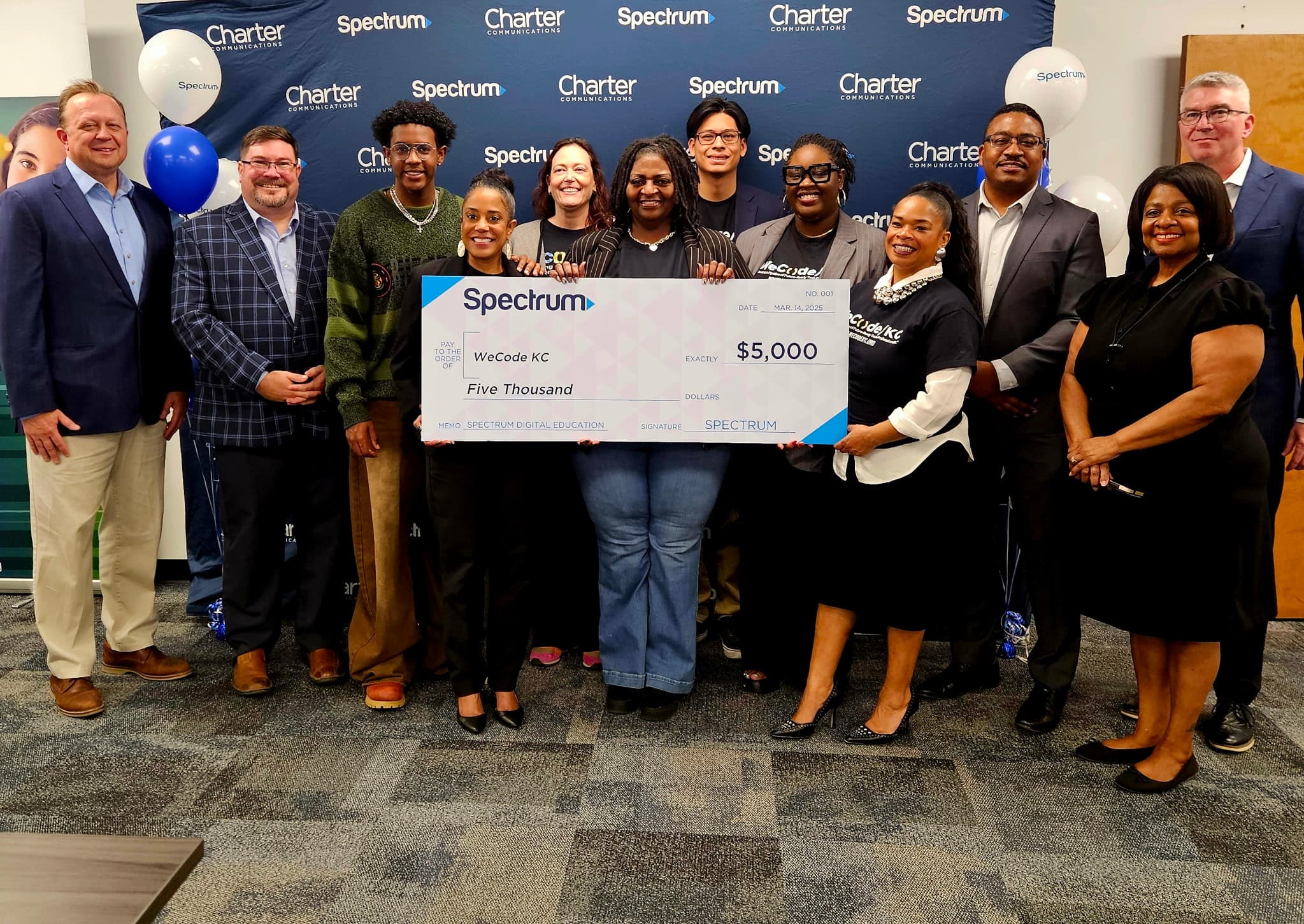 Picture of Spectrum donating to WeCode KC