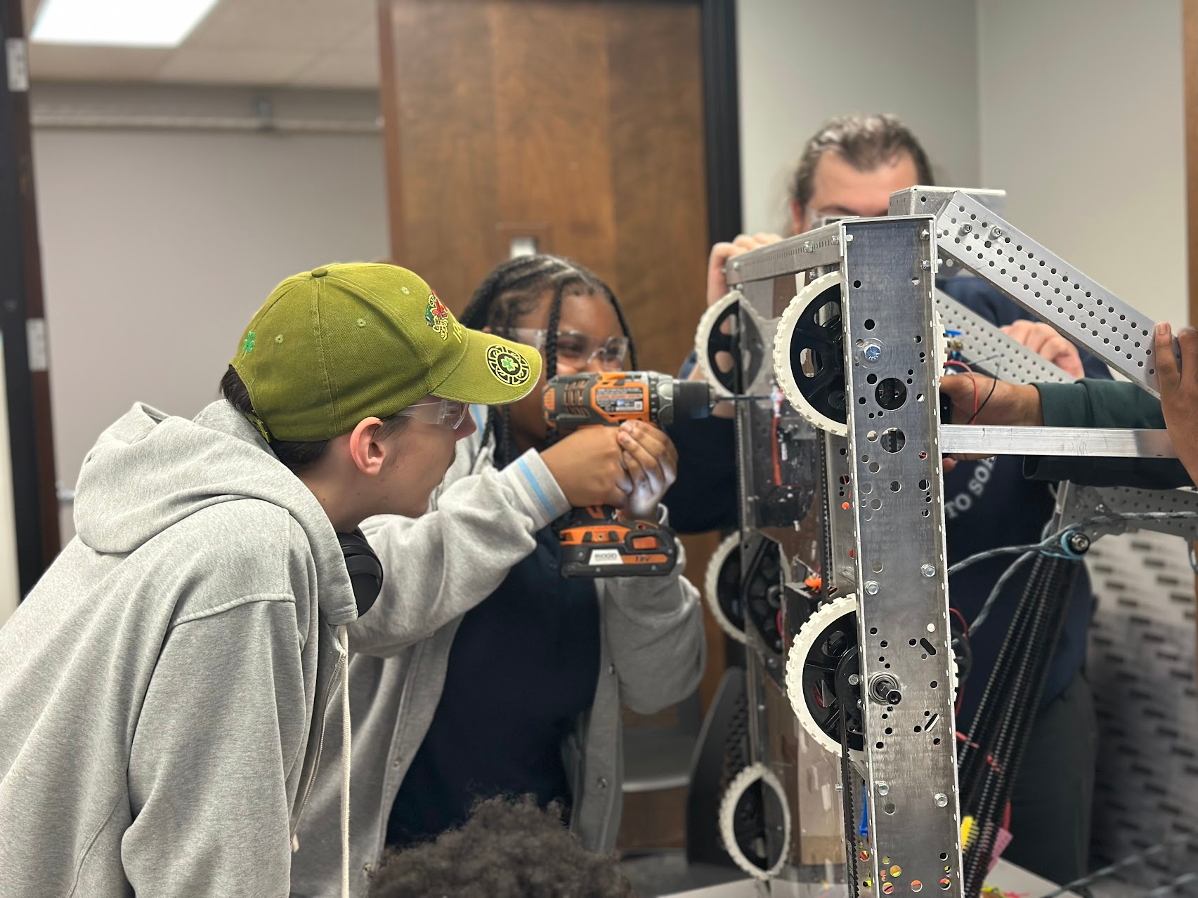 WeCodeKC students building and wiring their robot